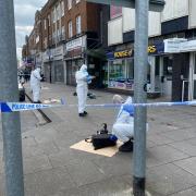 Images show forensics at work on Slough High Street after stabbing