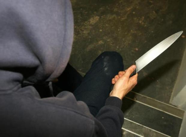 Slough Observer: Stock image of a person carrying a knife