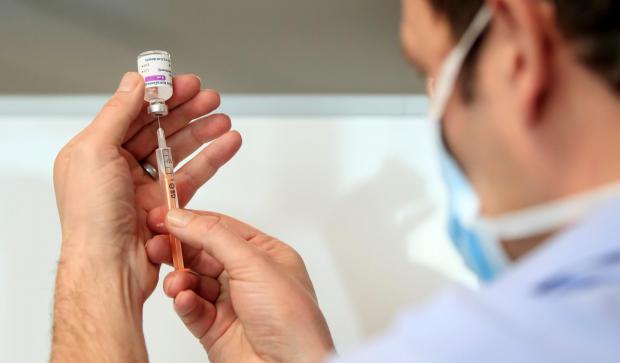 Slough Observer: A chief pharmacist prepares a Oxford/AstraZeneca coronavirus vaccine