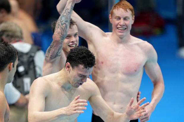 Great Britain's James Guy, Matthew Richards and Tom Dean celebrate gold in the Men's 4x200 freestyle relay at Tokyo Aquatics Centre on the fifth day of the Tokyo 2020 Olympic Games in Japan. Picture date: Wednesday July 28, 2021.