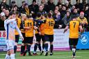 Slough Town celebrate their first goal in the 2-1 win against Wealdstone in the National League South at Arbour Park on Boxing Day. PHOTOS: Mike Swift. 191262.