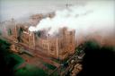 An image taken in November 1992 of Windsor Castle, the morning after the fire which severely damaged large sections of the building.