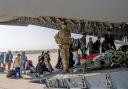British citizens and dual nationals residing in Afghanistan getting on a RAF plane before being relocated to the UK (PA)
