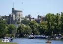 People in a boat make their way along the River Thames in Windsor, Berkshire. Picture date: Wednesday June 22, 2022.