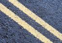 A stock image of double yellow lines