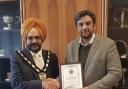 Atiq Ahmad Bhatti receives the award from the mayor