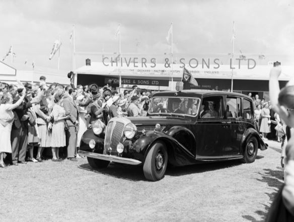A view of the Queen arriving by car at the Royal Show in the Great Park in 1954 
