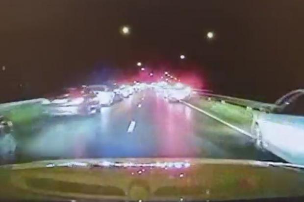 Dashcam footage from a police car attending a crash in Windsor