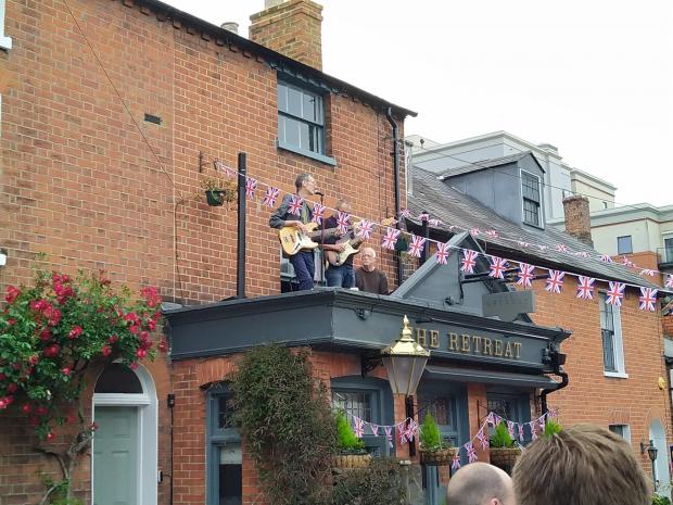 Slough Observer: A band plays in St John's Road on the roof of The Retreat