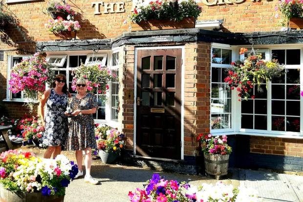 Slough Observer: The Rose and Crown welcomes visitors with open arms and blossoming flowers. 