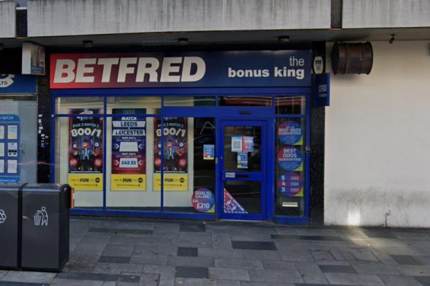 Police search for witnesses after woman, 40s, stabbed outside betting shop