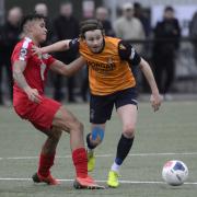 Slough Town midfielder Matthew Lench (amber) brushes off an opponent from Hungerford Town during the 2-0 defeat in the National League South at Arbour Park on Saturday. PHOTOS: Paul Johns.