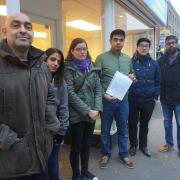 Angry complainants outside the deserted Berkshire Estate Agents office