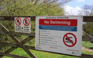 No Swimming warning sign on the Jubilee Flood Alleviation Channel