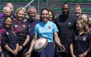 All smiles as Princess Kate meets with rugby players to discuss childhood experiences