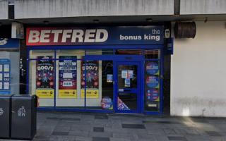 Police search for witnesses after woman, 40s, stabbed outside betting shop
