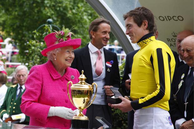 The Queen presents James Doyle with the Gold Cup after victory with Big Orange. All pictures: Sue Orpwood.