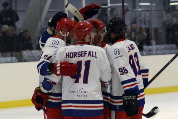 Slough Jets celebrate one of their 12 goals in the win against Cardiff Fire at the Slough Ice Arena on Saturday.