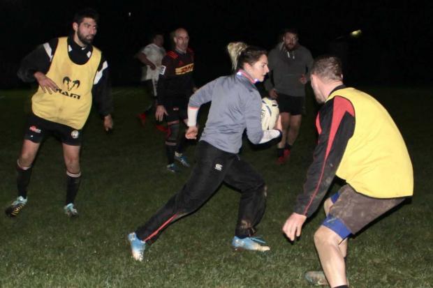 Wasps and England star Amy Wilson Hardy (ball in hand) demonstrates her skills in a training session at Phoenix Rugby Club on Tuesday.
